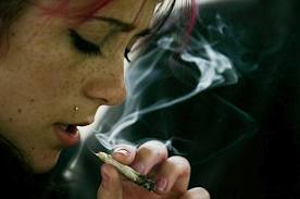 Women smoking marijuana joint.